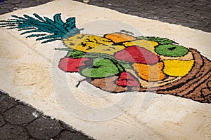 Alfombra, sawdust carpet with fruit bowl on street made for Semana Santa, Easter, Santiago Atitlan, Guatemala photo