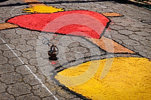 Alfombra, sawdust carpet with heart and incense bowl on street made for Semana Santa, Easter, Santiago Atitlan, Guatemala photo