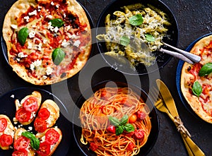 Italian vegetarian platter-pasta,bruschetta and pizza photo