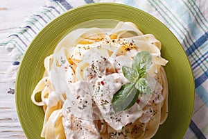 Alfredo pasta in cream sauce with chicken closeup. horizontal t