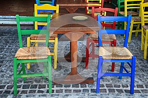 Alfresco outdoor cafe with multicolored chairs, Greece photo