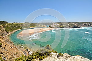 Algarve: Panoramic view to Praia de Odeceixe, Surfer beach and little village near Aljezur, Portugal photo