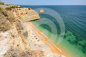 Algarve Portugal: Huge rocks at the cliff beach Praia da Marinha, lovely hidden beach near Lagoa