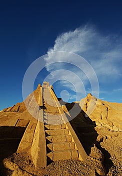 Algarve, Portugal 06232009: A sculpture of a brick pyramide with a ladder at the sand sculpture festival Fiesa, 2009