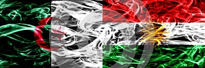 Algeria, Algerian vs Kurdistan, Kurdish smoke flags placed side by side. Concept and idea flags mix.
