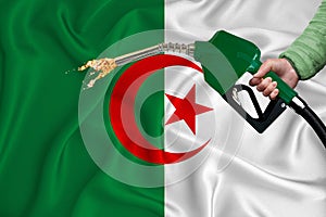 ALGERIA flag Close-up shot on waving background texture with Fuel pump nozzle in hand. The concept of design solutions. 3d