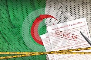 Algeria flag and Health insurance claim form with covid-19 stamp. Coronavirus or 2019-nCov virus concept