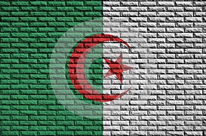 Algeria flag is painted onto an old brick wall