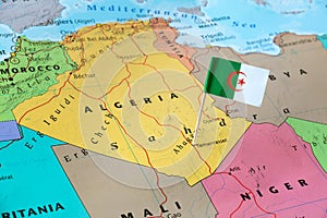 Algeria flag pin on map photo