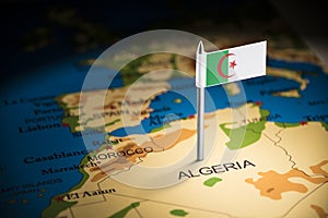 Algeria marked with a flag on the map