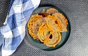 Algeria sweet food named zlabi, in Inde named Jalebi, it is prepared with flour and yogurt and honey and other ingredients photo