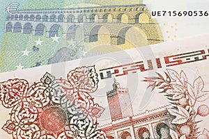 An Algerian dinar with a Euro note