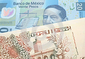 An Algerian dinar with a Mexican peso note