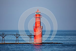 Algoma Pierhead Lighthouse in Algoma, Wisconsin in the summer with a blue sky
