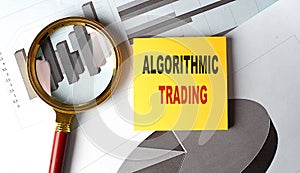 ALGORITHMIC TRADING text on sticky on chart background