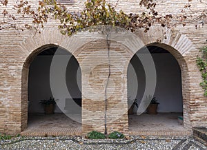 Alhambra antique brick wall arcs arabic architecture style