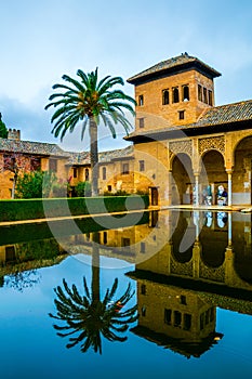 Alhambra de Granada. El Partal. A large central pond faces the arched portico behind which stands the Tower of the