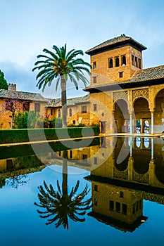 Alhambra de Granada. El Partal. A large central pond faces the arched portico behind which stands the Tower of the