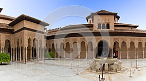 View at the exterior at the Patio at the Lions, twelve marble lions fountain on Palace of the Lions or Harem, Alhambra citadel, photo