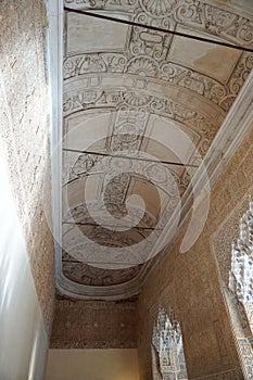 Alhambra Palace building interior ceiling decoration from Granada City. Spain.