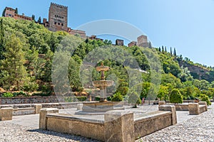 Alhambra palace viewed from Paseo de los Tristes in Granada, Spain photo