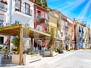 Alicante old town with colorful houses in ancient neighborhood El Barrio or Casco Antiguo Santa Cruz, Costa Blanca photo