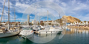 Alicante Port d`Alacant marina with boats and view of castle Castillo travel traveling holidays vacation panorama in Spain photo