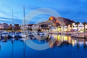 Alicante Port d`Alacant marina with boats and view of castle Castillo twilight travel traveling holidays vacation in Spain photo