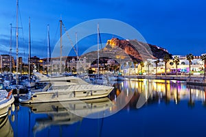 Alicante Port d`Alacant marina with boats and view of castle Castillo twilight travel traveling holidays vacation in Spain