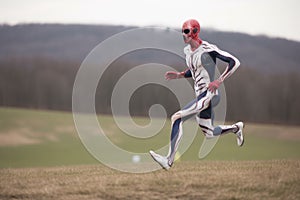alien athlete breaking free and running in open field during a sporting event