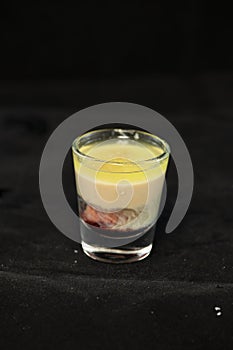 Alien Brain Hemorrhage shot cocktail with schnapps, blue curacao, baileys irish cream and grenadine