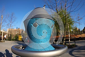 Alien spin wheel in a playground in Brooklyn new york