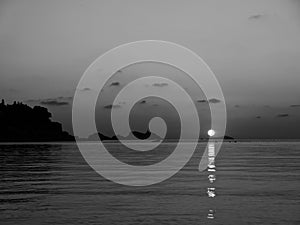 Alien sunset over the sea black and white