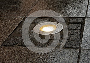 Alight lamp in pavement