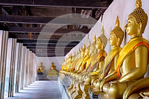 Aligned Buddha statues at Wat Phutthaisawan, Ayuthaya, Thailand.