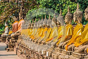 Aligned buddha statues Wat Yai Chai Mongkhon Ayutthaya bangkok T