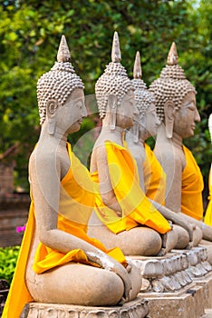 Aligned buddha statues at Wat Yai Chaimongkol Ayutthaya bangkok thailand