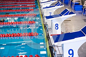 Aligned swimming starting block and platform with numbers