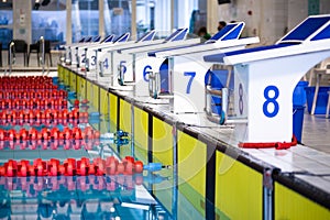 Aligned swimming starting block and platform with numbers