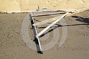 alignment of fresh concrete slab with special working tool