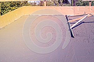 alignment of fresh concrete slab with a special working tool