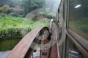 Alishan,taiwan-October 14,2018:Red train run in foggy day at alishan line on alishan mountain,taiwan