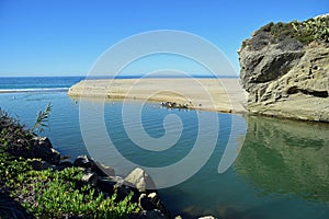 Aliso Creek draining into the ocean at Aliso Beach, Laguna Beach, California. photo