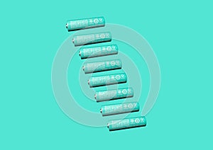 Alkaline AA batteries isolated on light green background. Recycling of rechargeable NiMH batteries