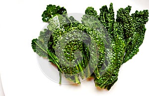 Alkaline, healthy food : kale leaves on white back