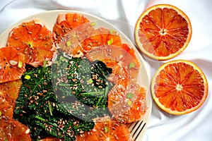 Alkaline, healthy food : kale and red blood orange salad photo