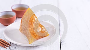 Alkaline rice dumpling zongzi - Traditional sweet Chinese crystal food on a plate to eat for Dragon Boat Duanwu Festival