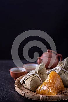 Alkaline rice dumpling zongzi - Traditional sweet Chinese crystal food on a plate to eat for Dragon Boat Duanwu Festival