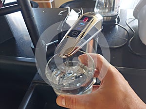 Alkaline water ionizer in a glass photo
