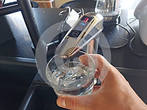 Alkaline water ionizer in a glass